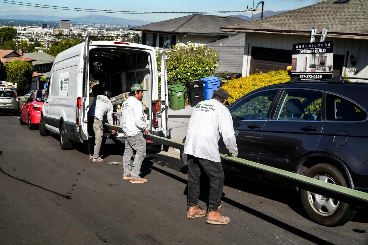 Coastline crew loading a seamless gutter run before heading to a Pasadena-area job.